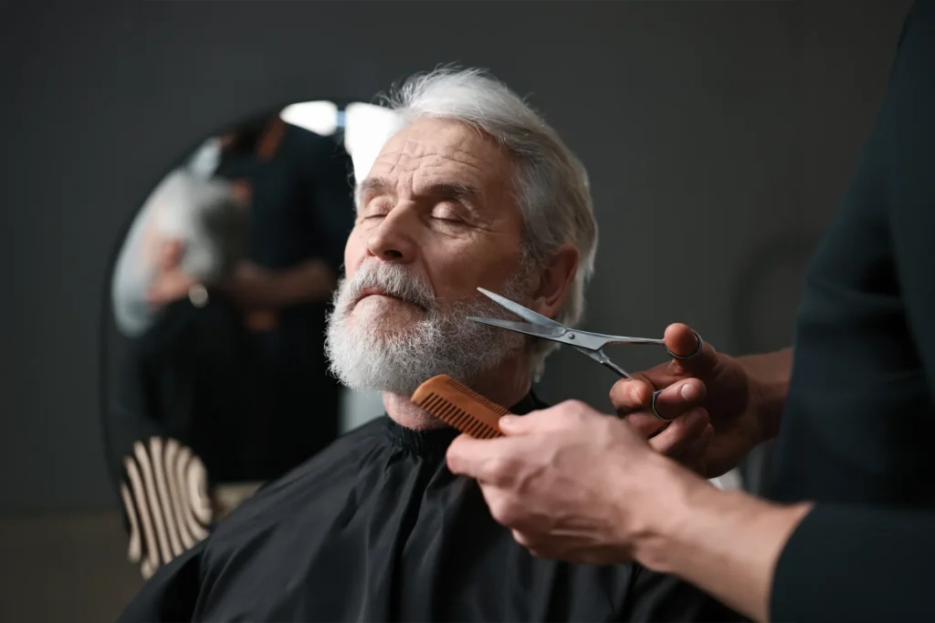 Senior man getting haircut